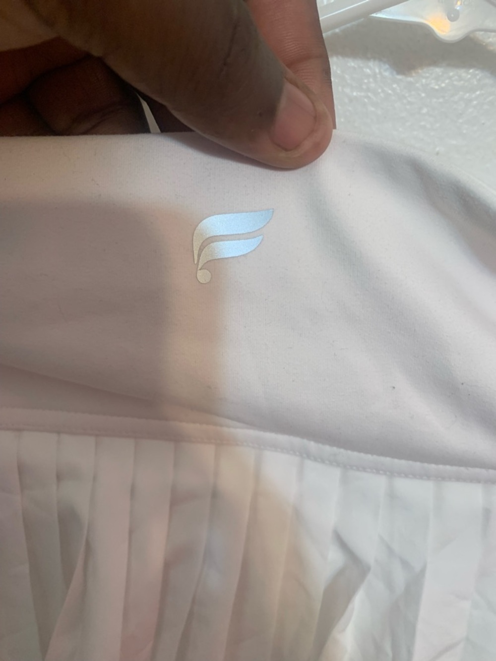 White Pleated Tennis Skirt with Wing Logo